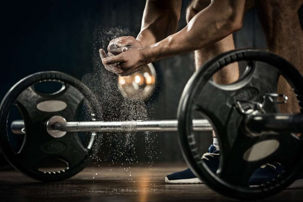 man using lifting strategy preparing to deadlift