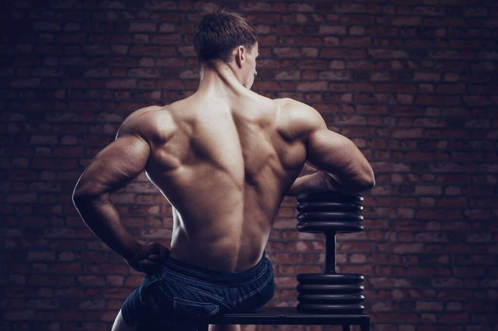 muscular man who used the best back exercises to build a strong back