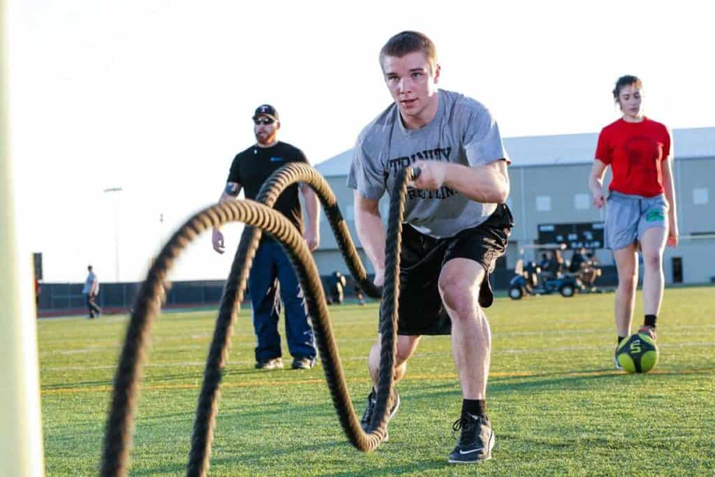 man using battle ropes for efficient forms of cardio intervals