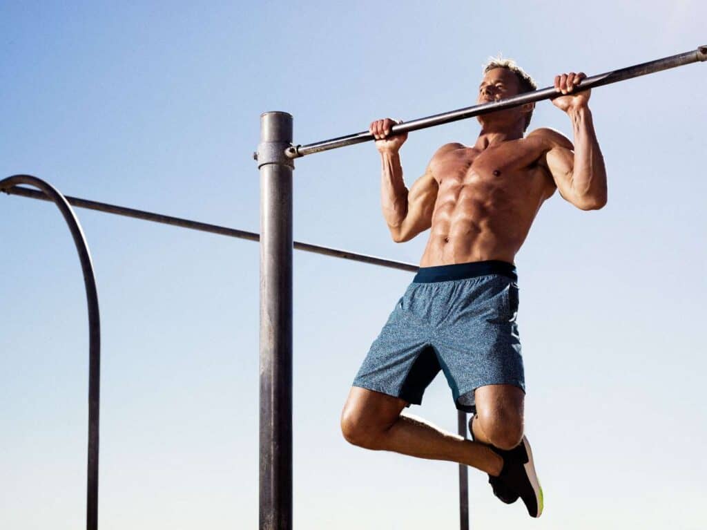 ripped athlete showing us how to do pull-ups