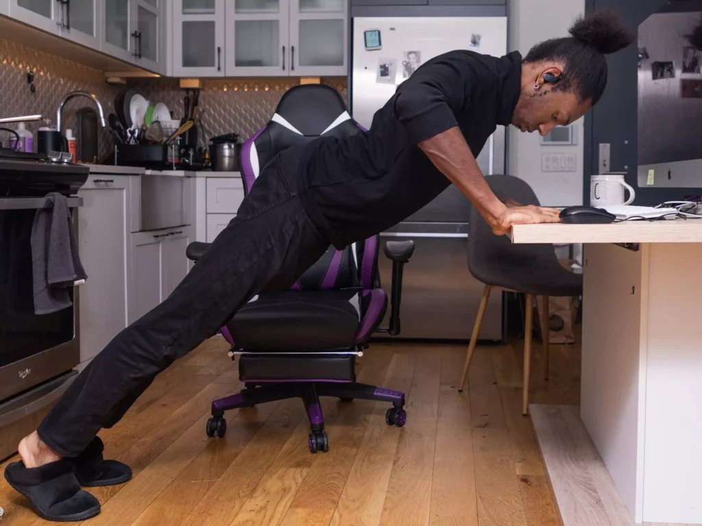 man performing desk exercises 